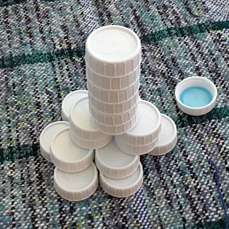 Stack of large bottle caps